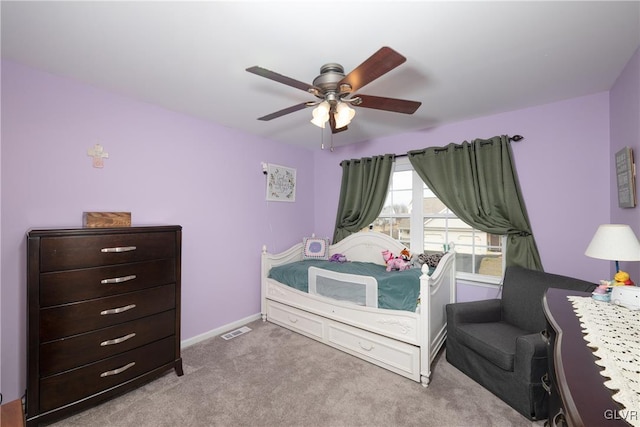 bedroom featuring visible vents, baseboards, ceiling fan, and carpet flooring