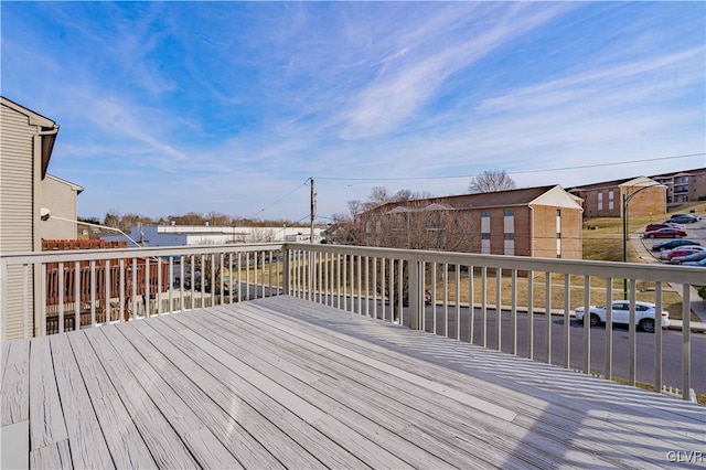 wooden deck featuring a residential view