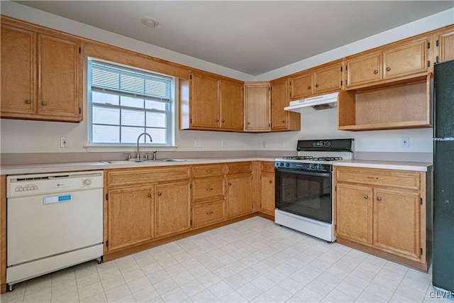 kitchen featuring range with gas stovetop, a sink, light countertops, under cabinet range hood, and dishwasher