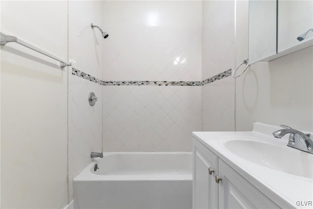 bathroom with vanity and shower / tub combination