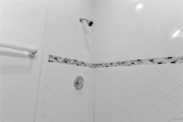 room details with a tile shower