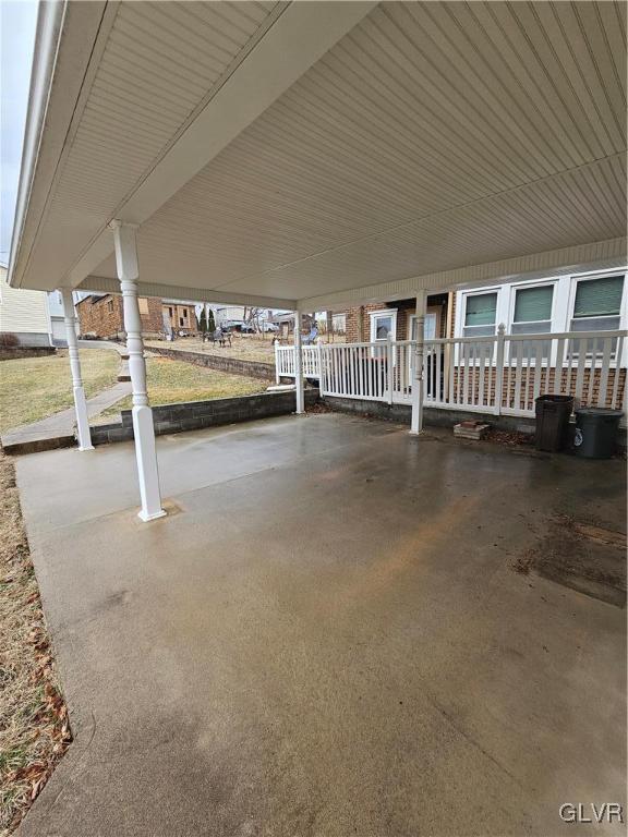 view of patio / terrace featuring an attached carport