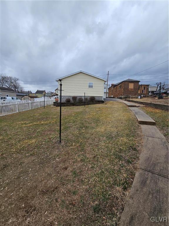 view of yard featuring fence