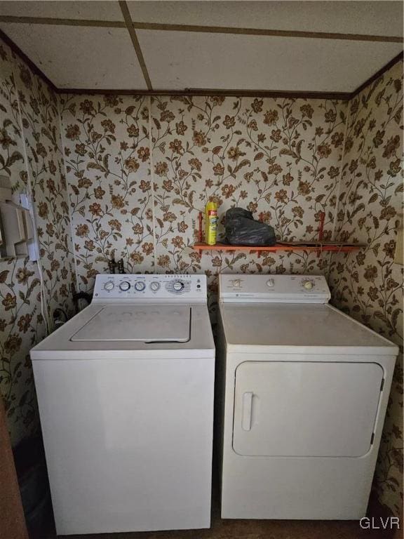 washroom with laundry area, independent washer and dryer, and wallpapered walls