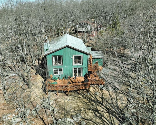 view of property exterior featuring an outbuilding