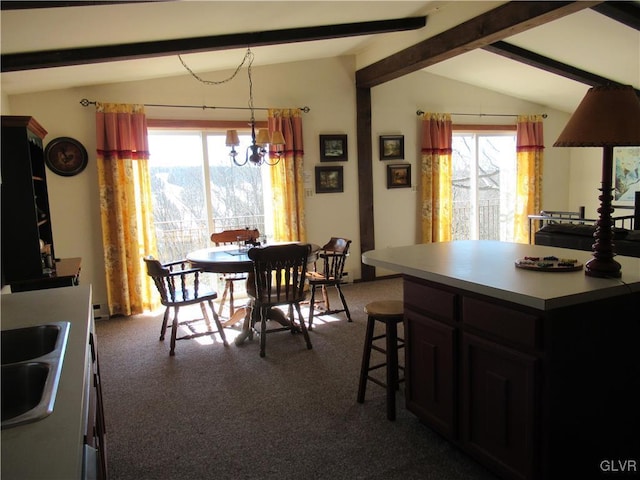 dining space with lofted ceiling with beams, a chandelier, and carpet flooring