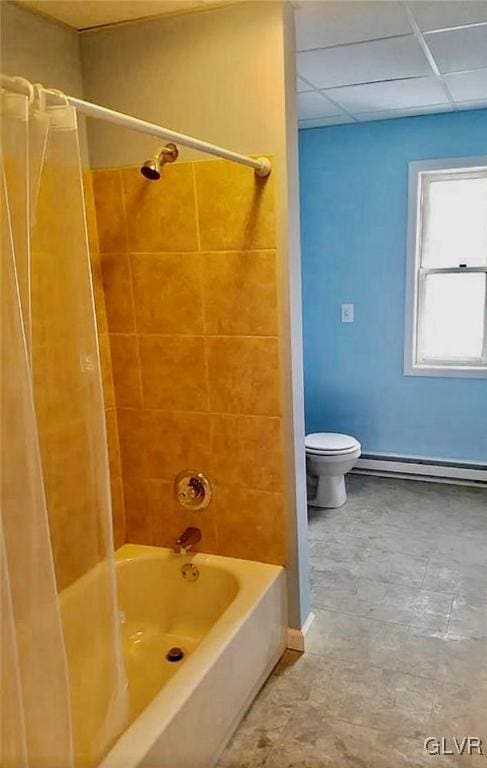 515 N Railroad St, Tamaqua Borough, PA 18252 - bathroom featuring a paneled ceiling, baseboard heating, washtub / shower combination, and toilet