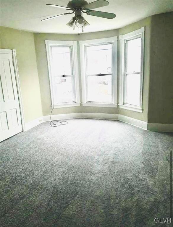 515 N Railroad St, Tamaqua Borough, PA 18252 - unfurnished room with baseboards, carpet floors, and a ceiling fan