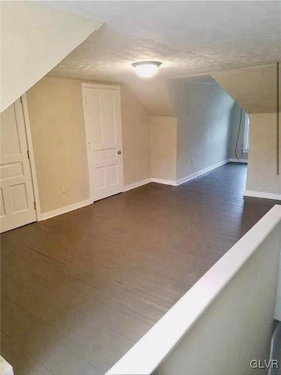 515 N Railroad St, Tamaqua Borough, PA 18252 - bonus room with dark wood finished floors, baseboards, and vaulted ceiling