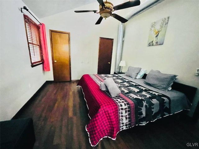 bedroom with wood finished floors, ceiling fan, and vaulted ceiling