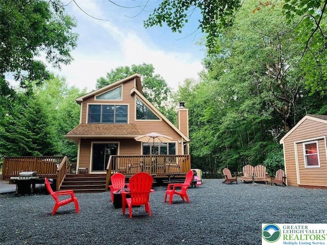 156 Poplar Pl, Tunkhannock Township, PA 18610 - exterior space with a fire pit and a deck