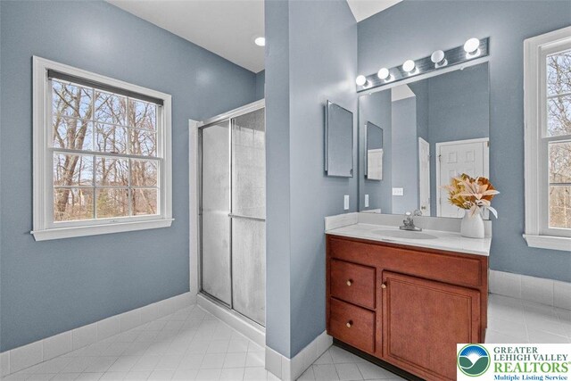 255 Rising Meadow Way E, Stroudsburg, PA 18302 - bathroom with vanity, a shower stall, and tile patterned floors