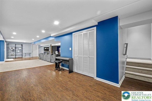 255 Rising Meadow Way E, Stroudsburg, PA 18302 - living room featuring recessed lighting, wood finished floors, and stairway