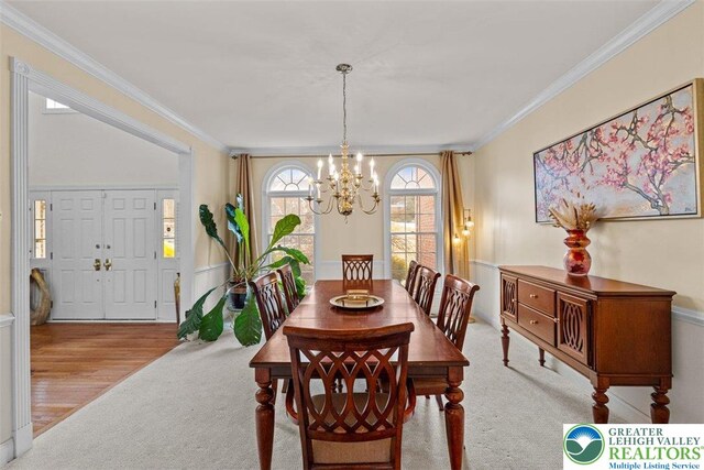 255 Rising Meadow Way E, Stroudsburg, PA 18302 - dining space with a chandelier, crown molding, and carpet floors