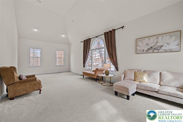 255 Rising Meadow Way E, Stroudsburg, PA 18302 - carpeted living area with high vaulted ceiling and plenty of natural light
