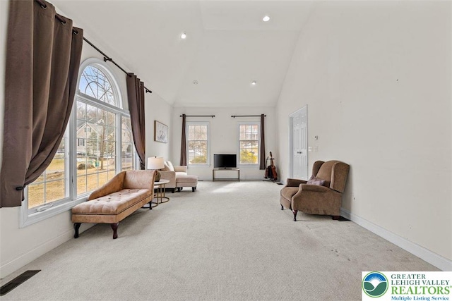255 Rising Meadow Way E, Stroudsburg, PA 18302 - living area with carpet floors, high vaulted ceiling, healthy amount of natural light, and recessed lighting
