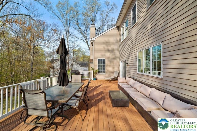 255 Rising Meadow Way E, Stroudsburg, PA 18302 - wooden terrace with outdoor lounge area and outdoor dining space