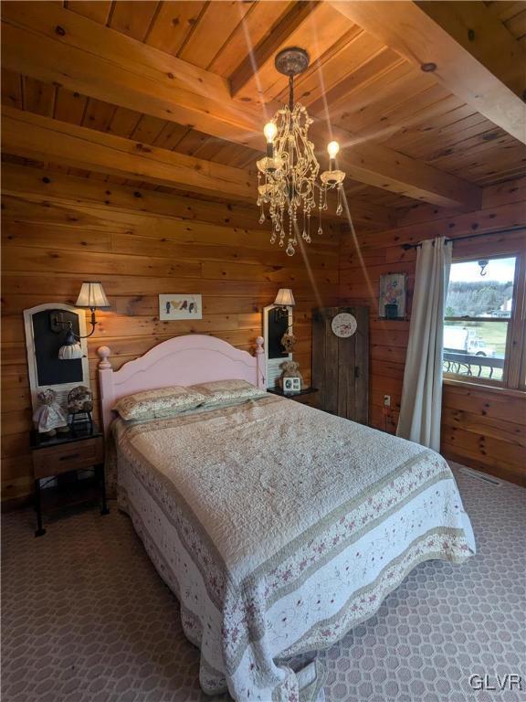 2533 Williams Rd, Moore Twp, PA 18014 - carpeted bedroom with wooden walls, wooden ceiling, beamed ceiling, and a notable chandelier