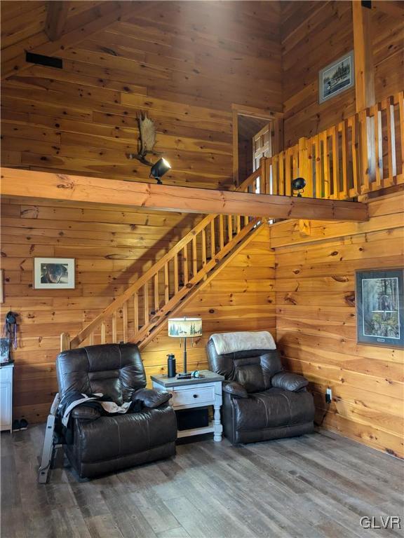 2533 Williams Rd, Moore Twp, PA 18014 - living area featuring wood walls, stairs, and a towering ceiling