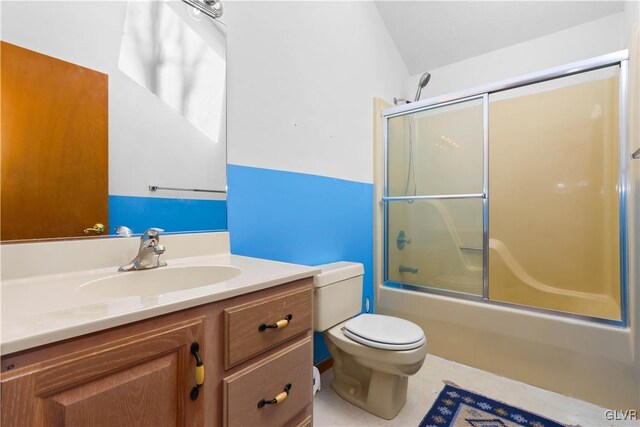 367 Saunders Dr, Lehman Twp, PA 18324 - bathroom with vaulted ceiling, toilet, vanity, tile patterned flooring, and shower / bath combination with glass door