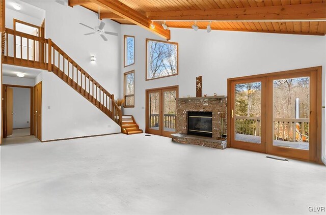 367 Saunders Dr, Lehman Twp, PA 18324 - unfurnished living room with beamed ceiling, wooden ceiling, and a healthy amount of sunlight