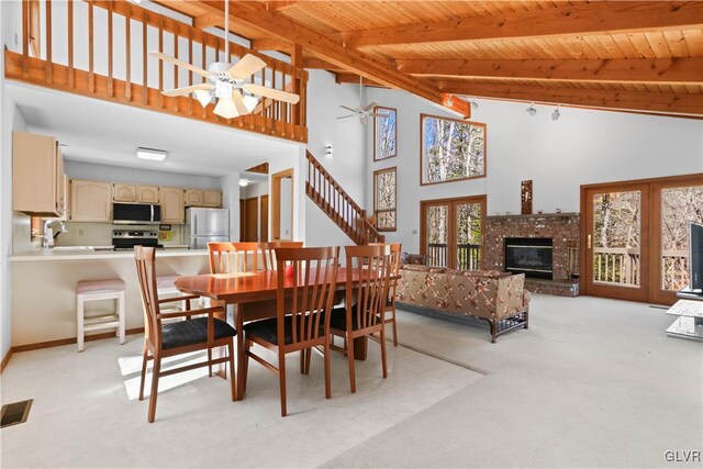 367 Saunders Dr, Lehman Twp, PA 18324 - dining area featuring high vaulted ceiling, ceiling fan, beam ceiling, wood ceiling, and light colored carpet