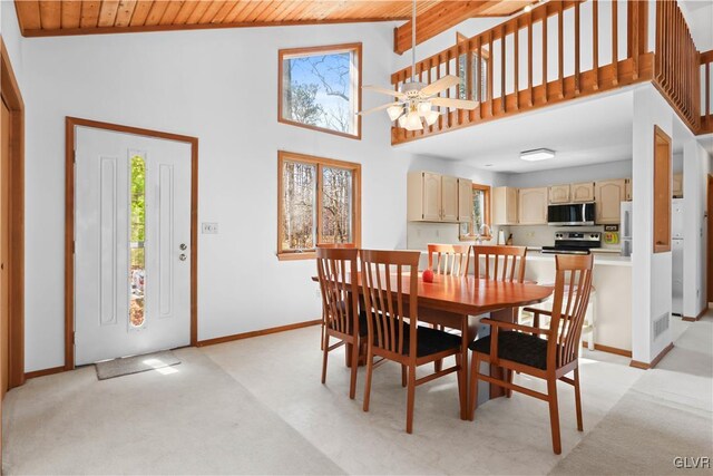 367 Saunders Dr, Lehman Twp, PA 18324 - dining area with baseboards, ceiling fan, a towering ceiling, wood ceiling, and light colored carpet