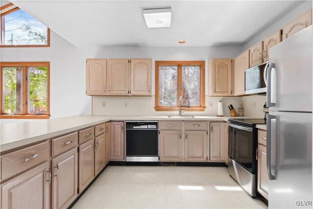 367 Saunders Dr, Lehman Twp, PA 18324 - kitchen with light countertops, a sink, stainless steel appliances, and light brown cabinetry