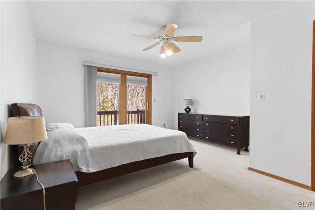 367 Saunders Dr, Lehman Twp, PA 18324 - bedroom featuring baseboards, access to exterior, light colored carpet, and ceiling fan