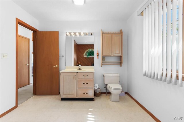 367 Saunders Dr, Lehman Twp, PA 18324 - bathroom with baseboards, toilet, and vanity