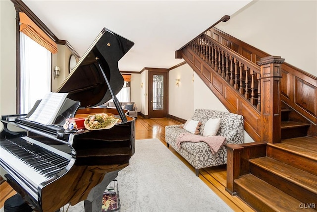 1527 W Turner St, Allentown City, PA 18102 - living area featuring stairs, wood finished floors, healthy amount of natural light, and crown molding