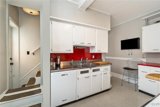 1527 W Turner St, Allentown City, PA 18102 - kitchen with white dishwasher, white cabinets, a sink, and baseboards