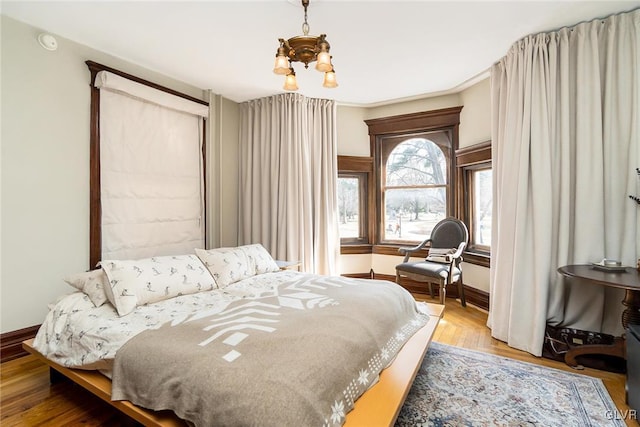 1527 W Turner St, Allentown City, PA 18102 - bedroom with baseboards, a chandelier, and wood finished floors