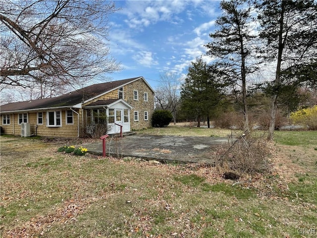 view of side of home featuring central AC unit