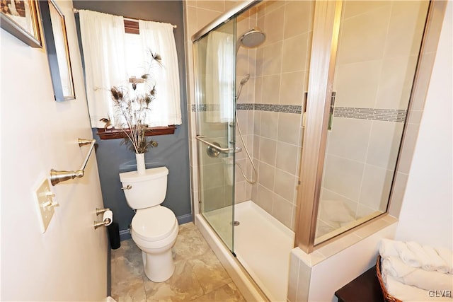 full bath with a shower stall and toilet