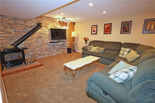 carpeted living room with recessed lighting, a wood stove, and baseboards