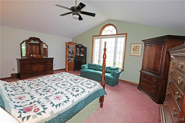 carpeted bedroom with baseboards, a ceiling fan, and lofted ceiling
