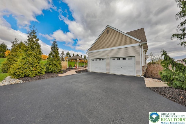 view of side of property with driveway