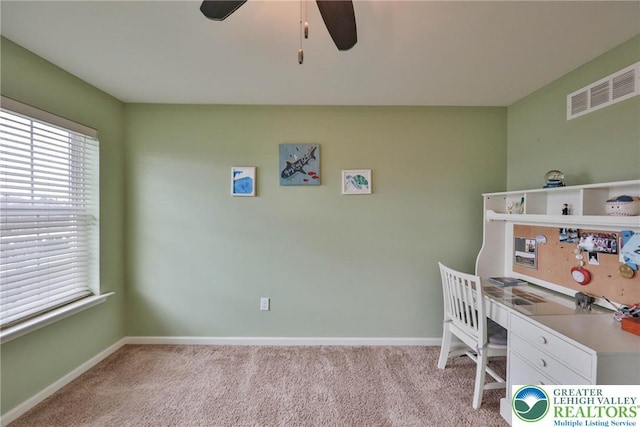 office area featuring light carpet, ceiling fan, baseboards, and visible vents