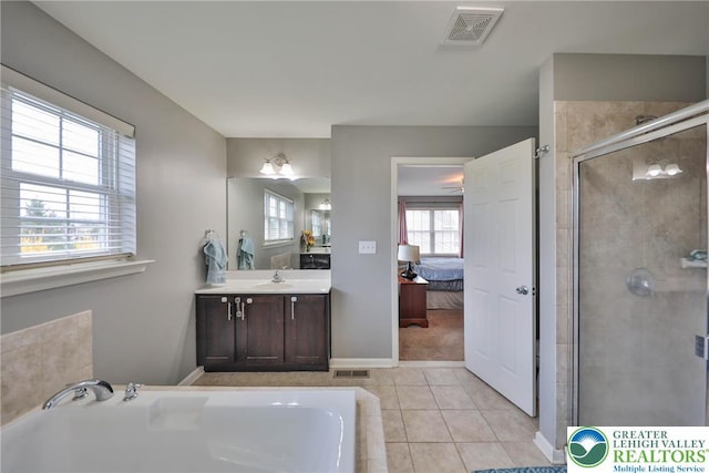ensuite bathroom featuring tile patterned flooring, ensuite bathroom, a shower stall, visible vents, and a bath