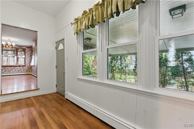 221 Franklin St, Alburtis Borough, PA 18011 - interior space featuring plenty of natural light, baseboard heating, a baseboard radiator, and wood finished floors