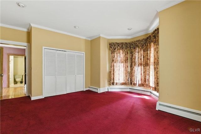 221 Franklin St, Alburtis Borough, PA 18011 - unfurnished bedroom featuring crown molding, carpet, a closet, a baseboard heating unit, and baseboards