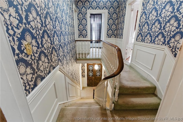 221 Franklin St, Alburtis Borough, PA 18011 - stairway with a decorative wall, wainscoting, and wallpapered walls