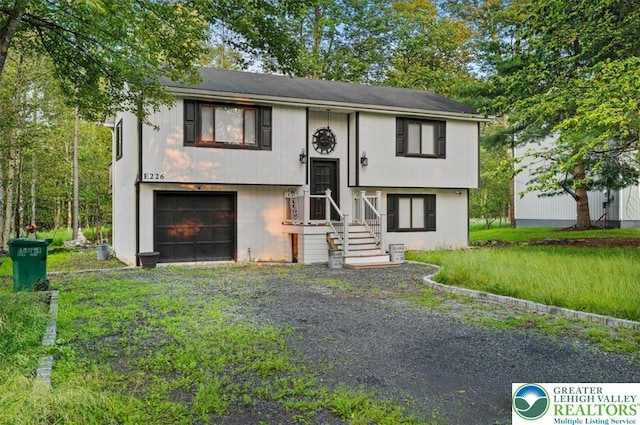 5627 Pembrook Dr, Coolbaugh Twp, PA 18466 - bi-level home with a garage and driveway