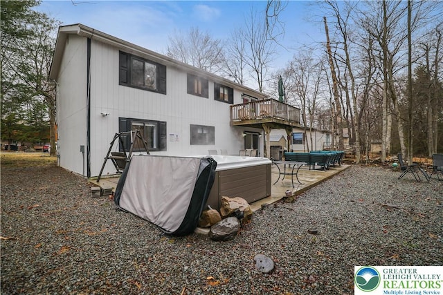 5627 Pembrook Dr, Coolbaugh Twp, PA 18466 - rear view of house with a wooden deck and an outdoor hot tub