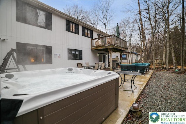 5627 Pembrook Dr, Coolbaugh Twp, PA 18466 - back of house with a hot tub, an outdoor living space, a deck, and a patio area