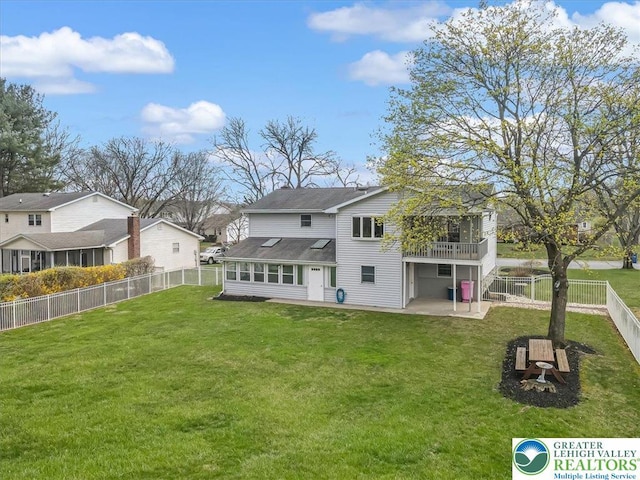 rear view of property with a patio, a residential view, a fenced backyard, and a lawn