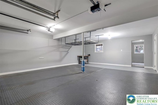 garage featuring baseboards and a garage door opener