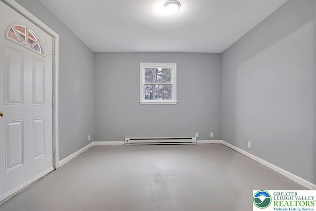 unfurnished room with a baseboard radiator, finished concrete floors, and baseboards
