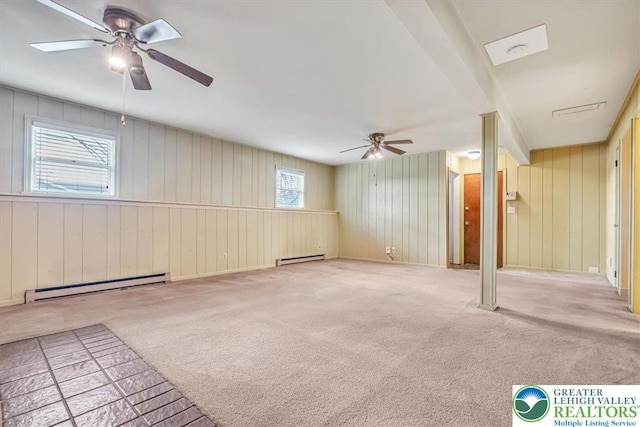 interior space featuring carpet flooring, a baseboard radiator, ceiling fan, and a baseboard heating unit